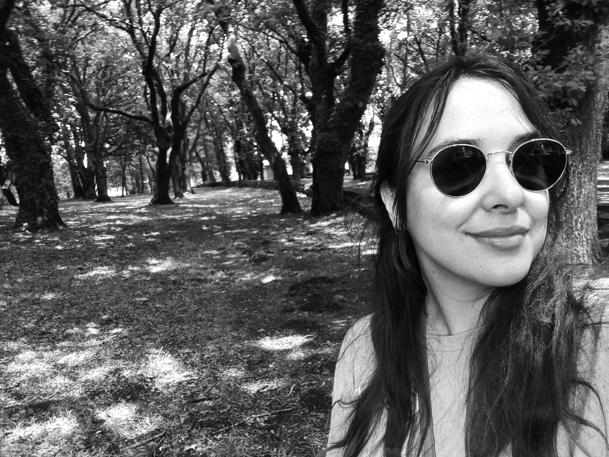 Deb with sunglasses looking at the camera